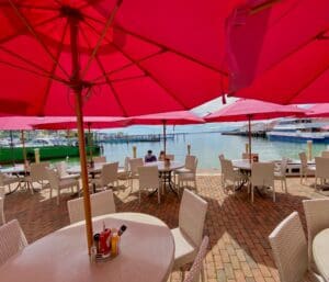 Pink Pony Patio is with their tables and chairs with waterfront views of the lake