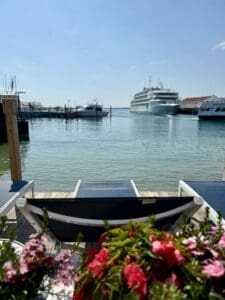 The sun deck at the Chippewa Hotel looking out towards the lake with a cruise ship in the background