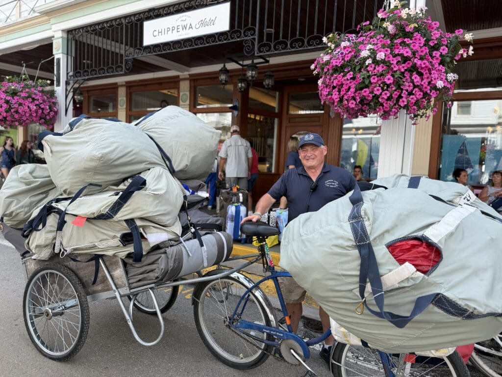 IMG_3859 one our dock porter with a lot of luggage in their bike basket and cart